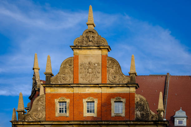 Magnificent gable decoration at the listed former Imperial Post Office in Berlin-Neukoelln (front to the "Karl-Marx-Strasse") stock photo
