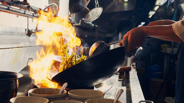 istock Chef stir fry cooking 1269140122