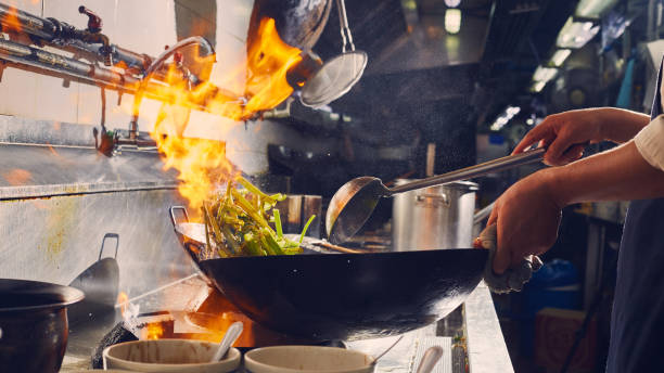 istock Chef stir fry cooking 1269140127