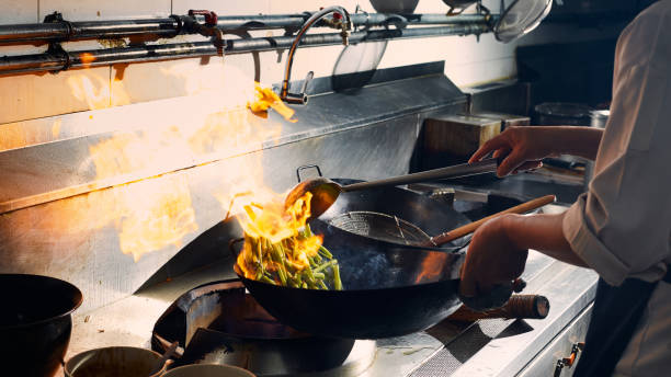 istock Chef stir fry cooking 1269140128