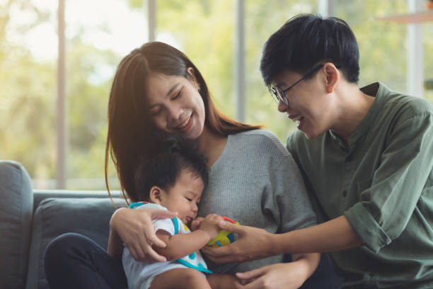Families of LGBTQ women Happy and warm with his adopted children. stock photo