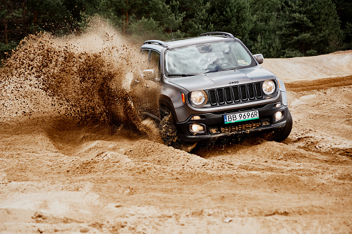 Siedlce Desert / Poland - 02 July 2017 : Fun in the desert with a 4x4 car. Jeep Renegade is doing great in the slushy sand.