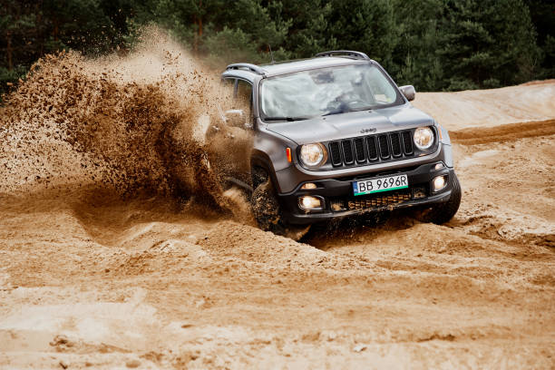 Jeep Renegade Siedlce Desert / Poland - 02 July 2017 : Fun in the desert with a 4x4 car. Jeep Renegade is doing great in the slushy sand. off road vehicle photos stock pictures, royalty-free photos & images