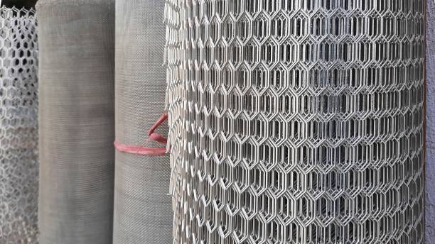 istock pile of metal mesh or fence rolls with selective focus 1269146404