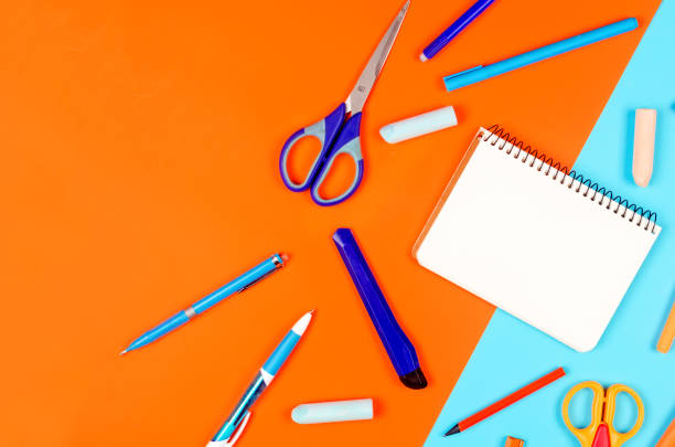 istock School supplies on blue and orange background. Education concept. 1269150272