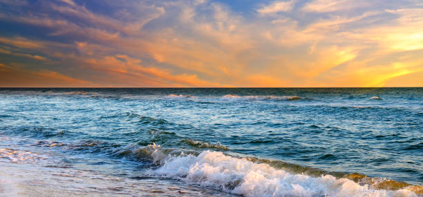 istock Sunrise over the sea and beautiful cloudscape. 1269151207