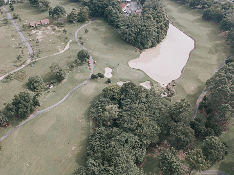 Drone point of view golfer playing golf in golf course in melaka