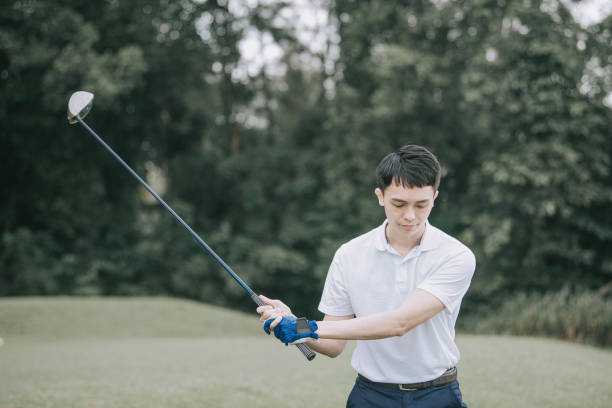 istock Asian chinese male golfer playing golf teeing off 1269152425