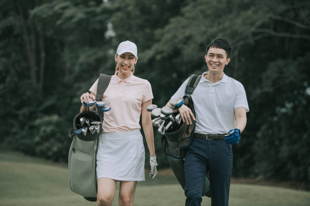 istock asian chinese couple golfer walking in golf course getting ready to play golf during weekend happily 1269152557