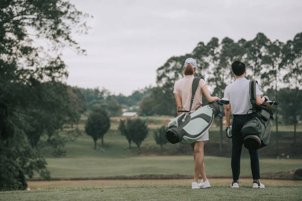 istock asian chinese couple golfer walking in golf course getting ready to play golf during weekend happily 1269153389