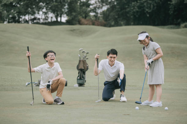 istock asian chinese parent golfer teaching daughter playing golf at golf course weekend 1269153416