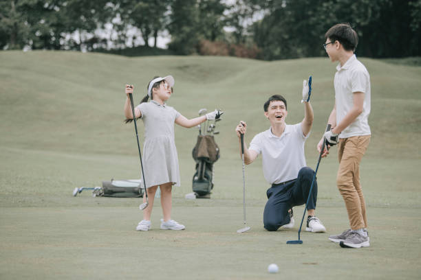 istock asian chinese parent golfer teaching son playing golf at golf course weekend 1269153431