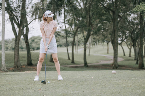 istock Asian chinese female golfer playing golf teeing off 1269153469