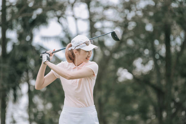 istock Asian chinese female golfer playing golf teeing off 1269153541