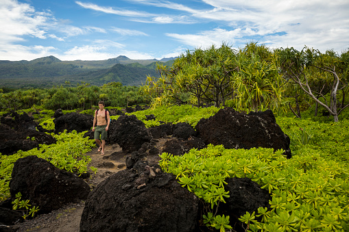 Tourist hiking  near Hana, Maui.