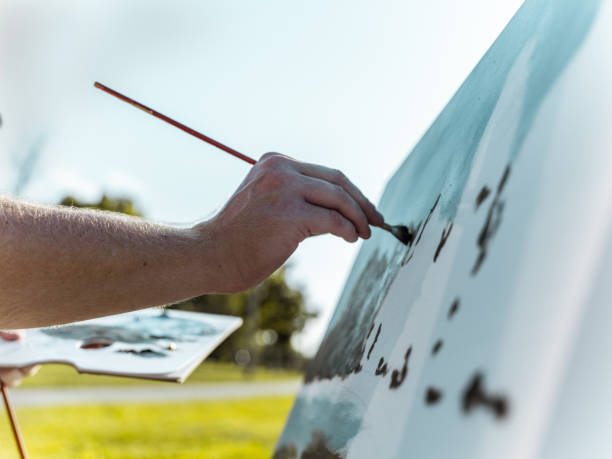 istock Hands of the painter at the Lake 1269155702