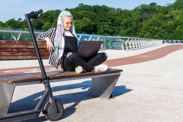 istock Young woman riding electric scooter 1269156191