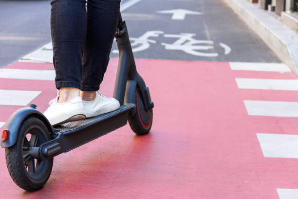 istock Young woman riding electric scooter 1269156254