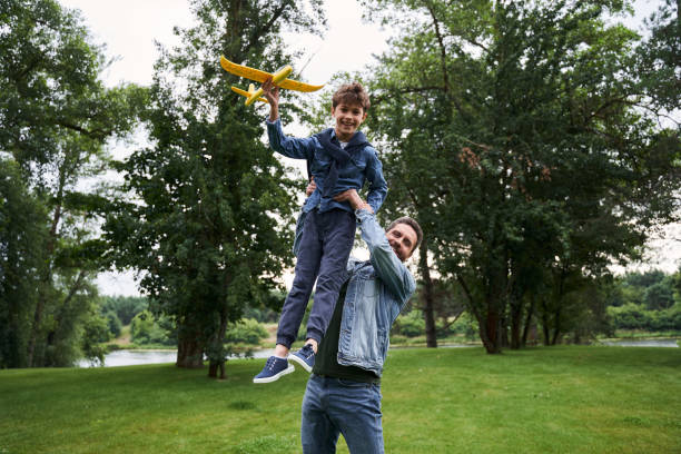 istock Cheerful father having fun with son outdoors 1269156851