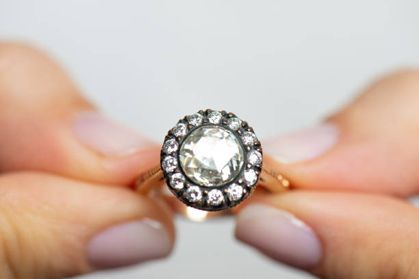 istock Woman Holding A Diamond Ring 1269157431