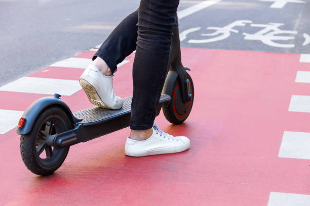 istock Young woman riding electric scooter 1269158189