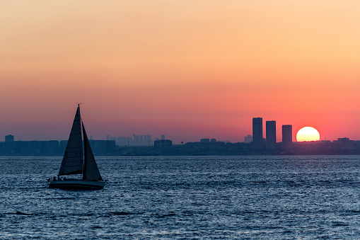 Sailboat advancing at sunset in Istanbul, Turkey.