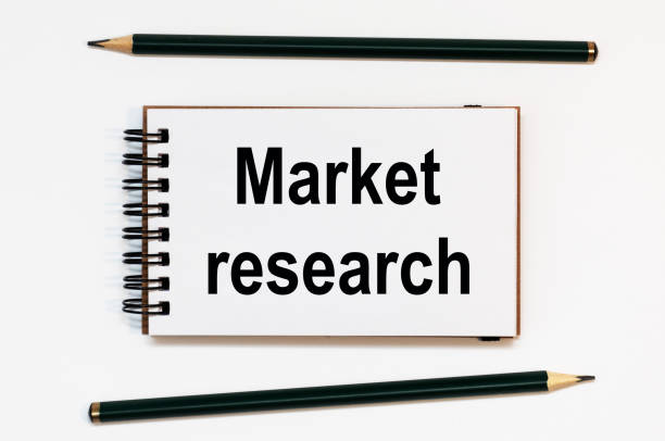 istock WHITE SPIRAL NOTEBOOK, TWO PENCILS WITH TEXT market research 1269160498