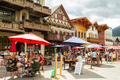 Leavenworth, WA - August 21st, 2020: Visitors are enjoying the outdoor seating on Main street which has been closed off for pedestrian access only during the covid-19 pandemic.