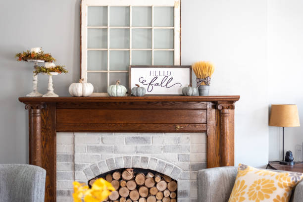 Stylish fall decorations on the mantel at home Stylish fall home decor in gray and gold farmhouse photos stock pictures, royalty-free photos & images