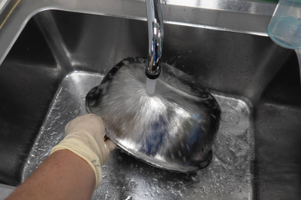 istock large silver saline bowl is cleaned in an OP 1269163362