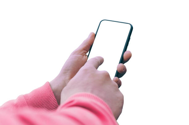 istock Mock-up Technology. A guy in a pink sweater holding a smartphone with a screen isolated on a white background. 1269163577