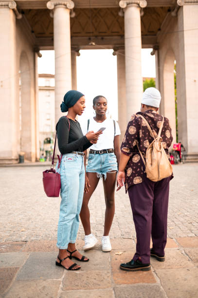 istock Friends standing on the city square and talking 1269164112