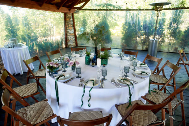 istock A table in the restaurant, decorated with decor, colored bottles with paws ate.An open veranda made of wood and stone. Heat gun 1269164810