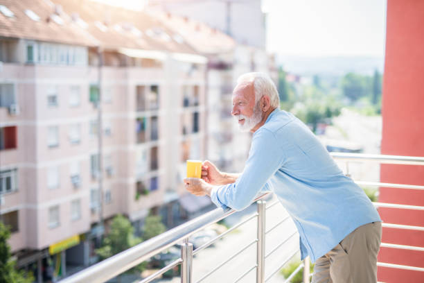 istock Mature man relaxing at home balcony. 1269168997