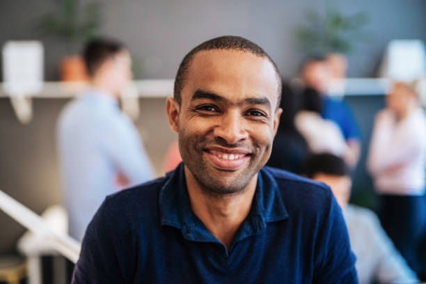 istock Mature mixed race freelancer in co-working space, back in office after lockdown 1269169103