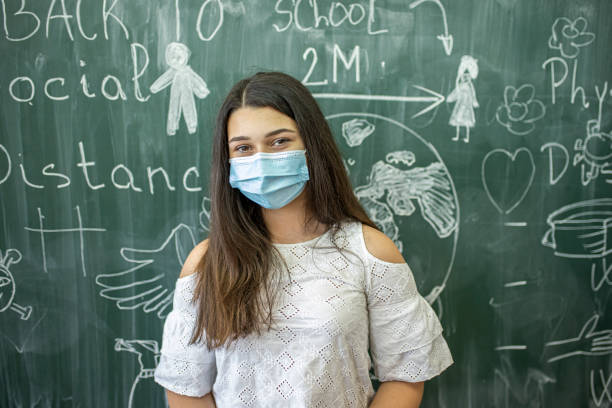 istock Elementary age girl is back in a classroom after the covid-19 quarantine. 1269170153