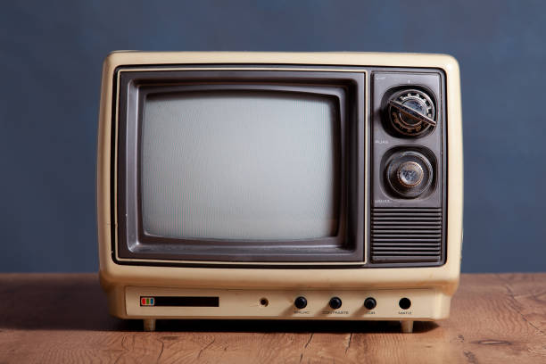 istock Retro television in front of a textured background. 1269172170