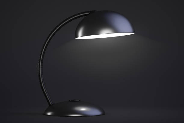 istock The black table lamp is on. Dark background. 1269172645