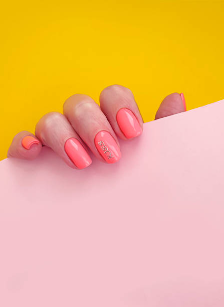 istock female hand beautiful manicure on a colored background 1269173392