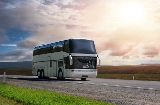 istock tourist bus carries passengers along a landscape 1269173398