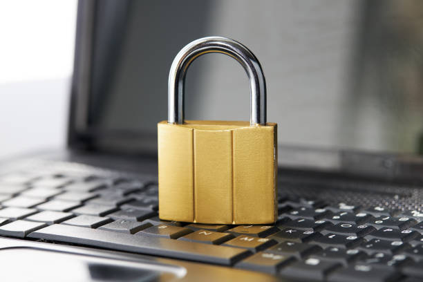 istock golden padlock on a black laptop keyboard over white background. internet security concept. antivirus software concept. electronic wallet symbol 1269173419