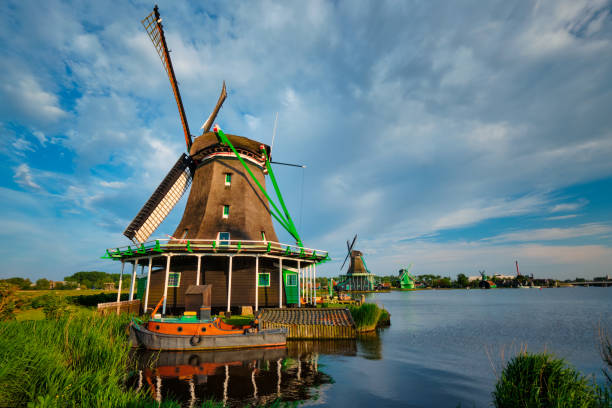 Windmills at Zaanse Schans in Holland. Zaandam, Nether Netherlands rural lanscape - windmills at famous tourist site Zaanse Schans in Holland. Zaandam, Netherlands zaanse schans stock pictures, royalty-free photos & images