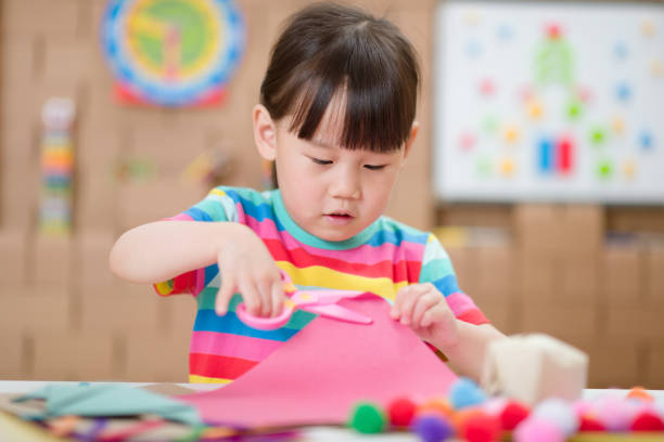 istock young girl making craft for home schooling 1269178327