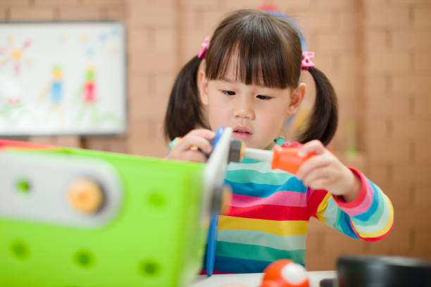 istock young girl playing creative toy blocks for home schooling 1269178346