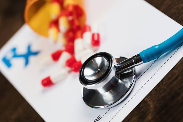 istock Prescription form with pills and stethoscope 1269180774