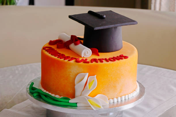 istock graduation cake with green grass background isolated 1269188400