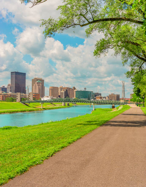 Dayton Ohio park is surrounded by the downtown district The Great Miami River runs through a river walk area in the River Scape of the Five Rivers Metroparks area of Dayton, Ohio, USA. A path follows the river into the park. dayton ohio photos stock pictures, royalty-free photos & images