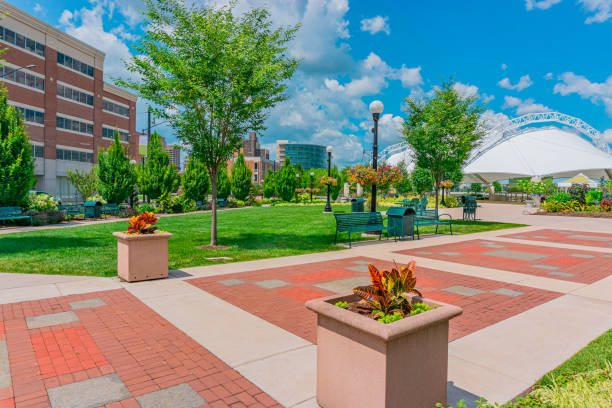 The Dayton Ohio downtown also has a beautiful park next to the river. Five Rivers Metropark is filled with flowers and a recreational dome, in the midst of Dayton, Ohio. This is next to the Miami River in the downtown district. dayton ohio skyline stock pictures, royalty-free photos & images