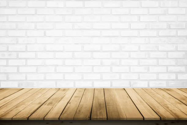 istock Empty wooden table top on white brick wall background, Design wood terrace white. Perspective for show space for your copy and branding. Can be used as product display montage. Vintage style concept. 1269197493