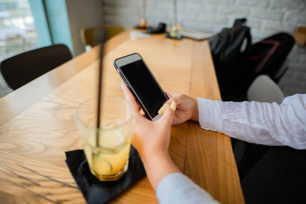 istock Close-up of women using her mobile phone 1269197513